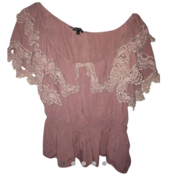 Pink top with crotchet detail.