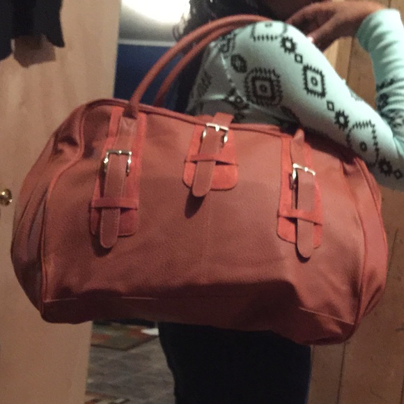 Cute brown Estée Lauder carry on