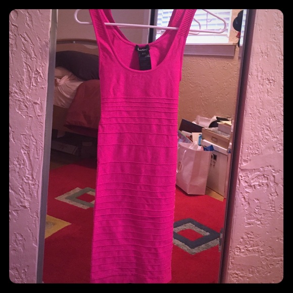 Neon pink bebe bandage dress with open back