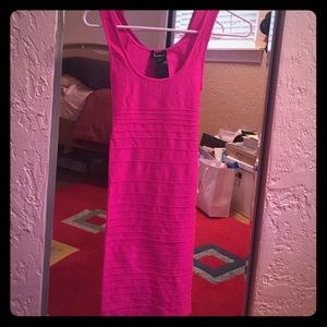 Neon pink bebe bandage dress with open back