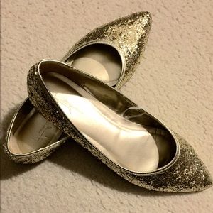 Pointy toed gold glitter flats