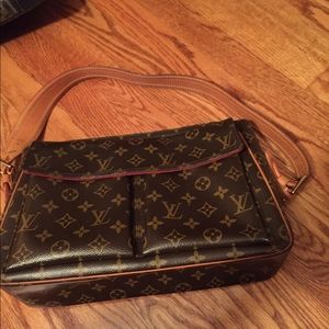Louis Vuitton bag and makeup clutch.