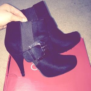 Black suede ankle booties with gunmetal hardware