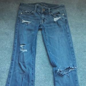 Destroyed light blue jeans