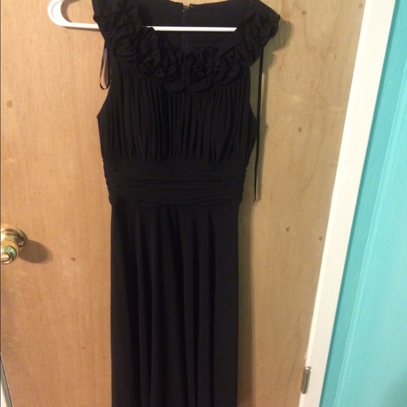 Floor length black dress with flower detail. - Picture 1 of 3