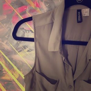 Gray button up sleeveless shirt with pockets
