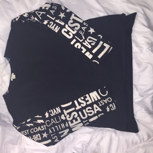 Baggy Black sweater with cream print on sleeves.