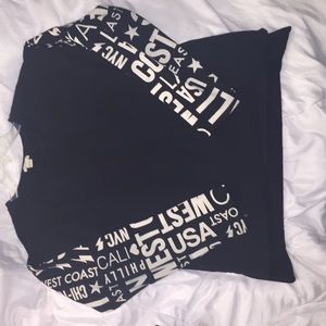 Baggy Black sweater with cream print on sleeves.