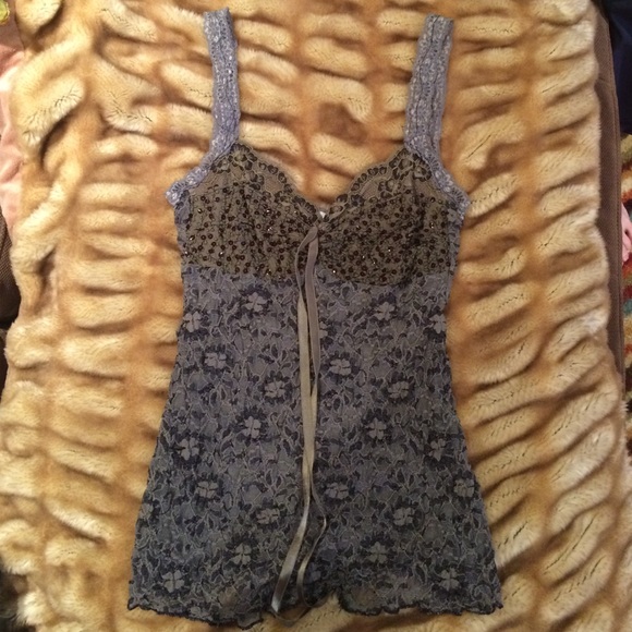 Gray tank top with lace and sequins.