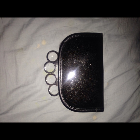 Brass knuckle clutch wallet