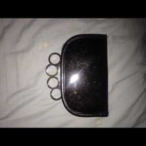 Brass knuckle clutch wallet