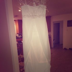 Wedding dress. Never been worn. No alterations