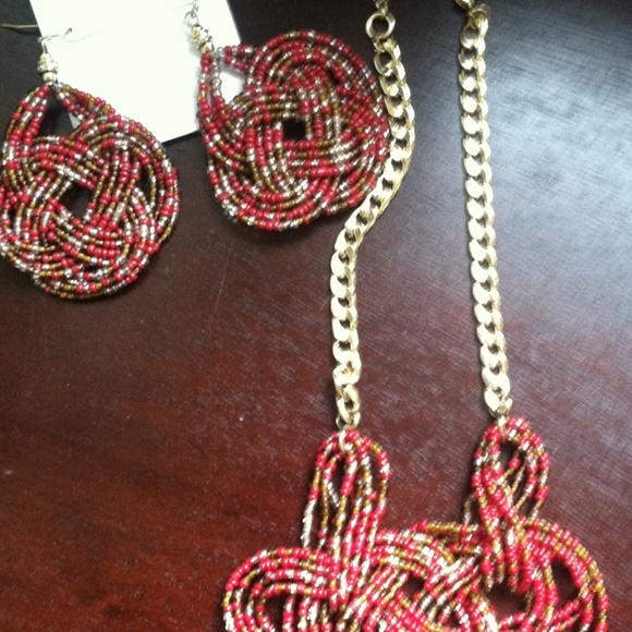 A pair of unique earrings with matching necklace