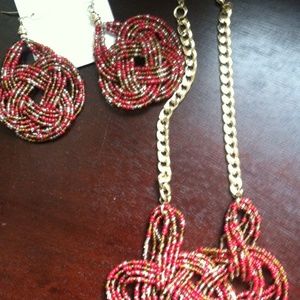 A pair of unique earrings with matching necklace