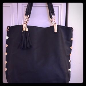 Black medium size tote bag with gold accents