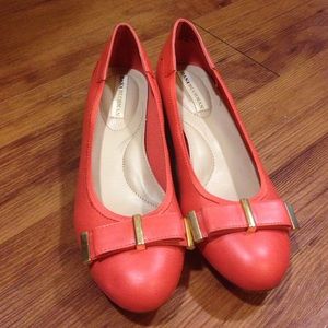 Coral flats with gold accents