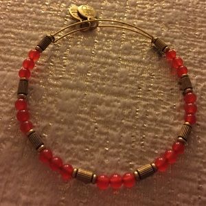 Small red beaded Alex and Ani