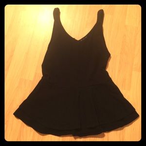 Black peplum tank with zip back closure