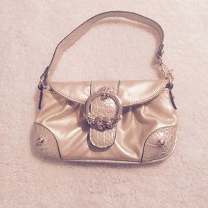 Kathy Van Zeeland gold wristlet