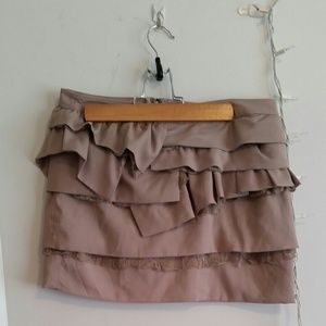 Light brown, ruffle and lace skirt.