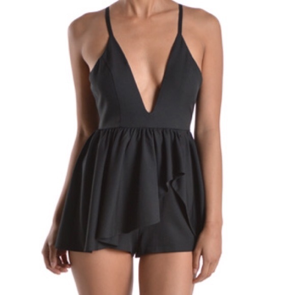 Peplum romper in Black. sz. Small