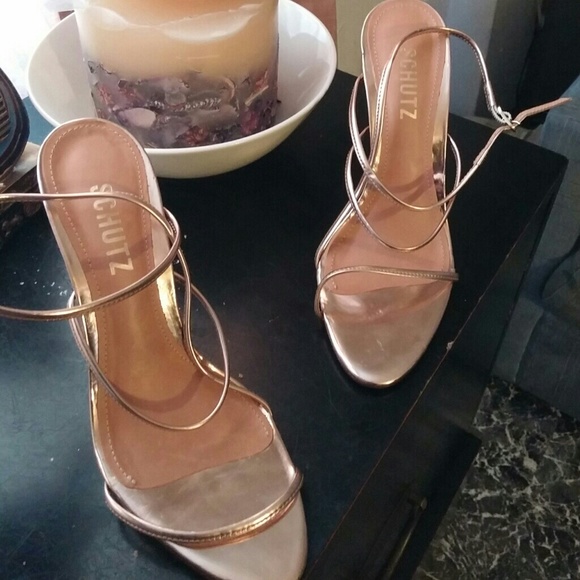 Gold heels wraps around the ankle