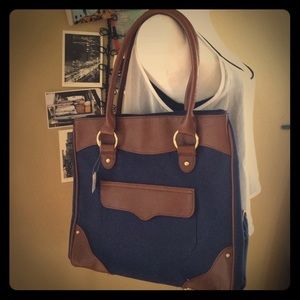 A classic style bag in navy & brown trim. NWT