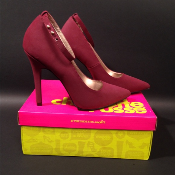 Burgundy pumps with ankle strap detail.