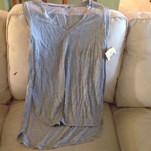 Grey v-neck shirt. short in the front long in back