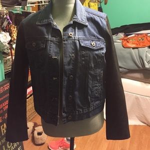 Denim jacket with leather sleeves