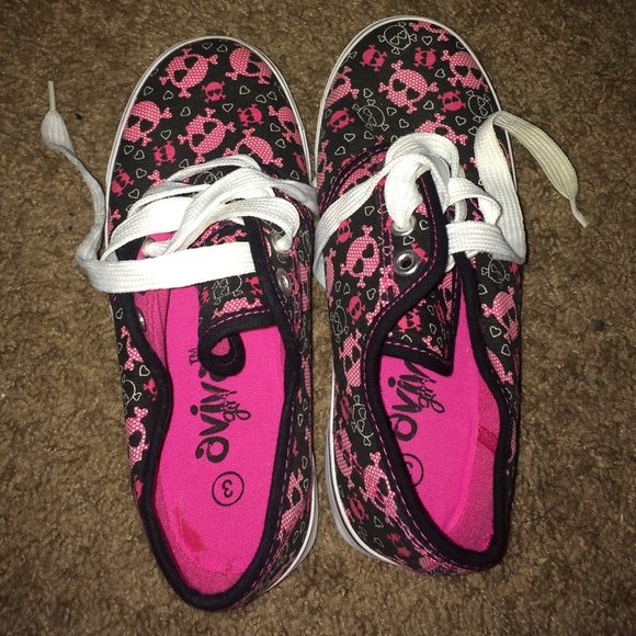 Black shoes with pink skulls.