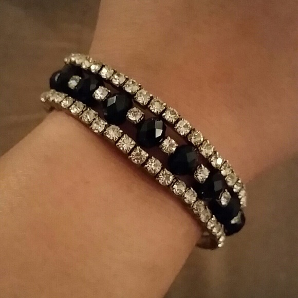 Black bracelet with silver rhinestones.