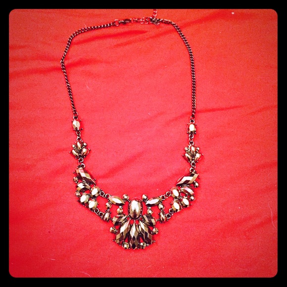 Dark colored necklace.