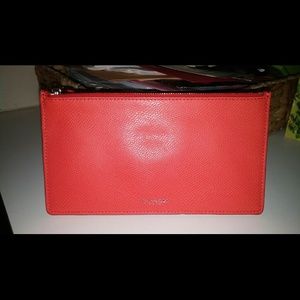 Coral orange coach zippered pouch