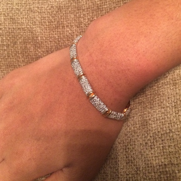 Gold plated silver bracelet with diamond accents.