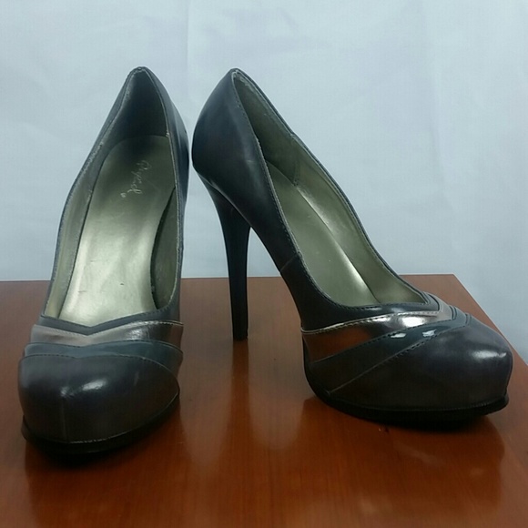 Lightly worn, gray and silver heels.