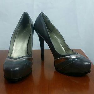 Lightly worn, gray and silver heels.