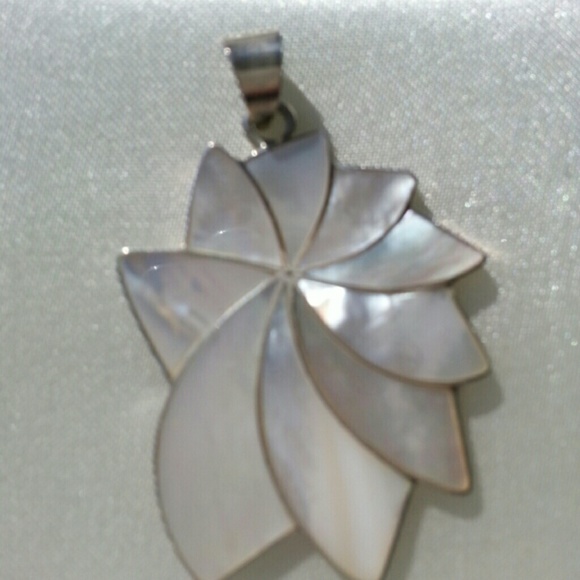 Sterling silver and mother of pearl pendant.