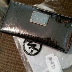 Authentic MK continental jet set wallet