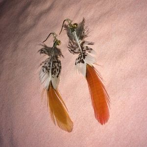 Feather earrings.