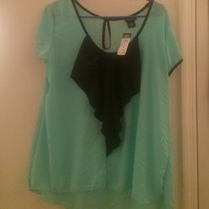baby blue blouse with black bow.