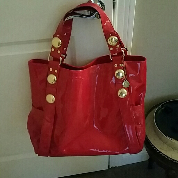 Red patent leather Big Buddha bag.