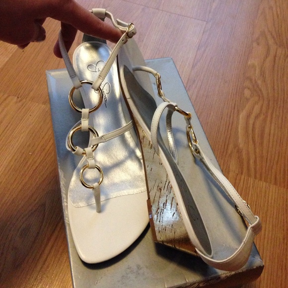 Jessica Simpson white and gold sandals.