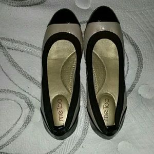 Nude and black flats