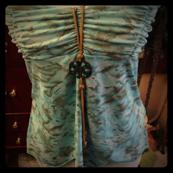 Light blue and tan top with bohemian accent charm