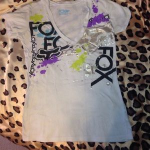 Fox White v-neck with colorful patches.