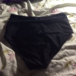 High waisted black bathing suite bottom.