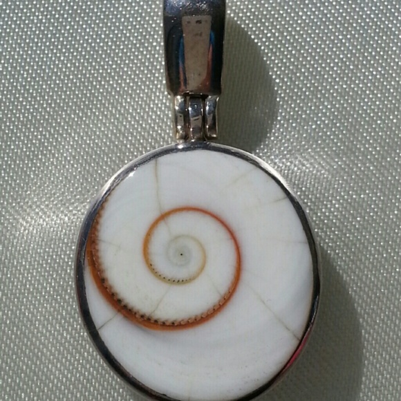 Sterling silver and shell slide.
