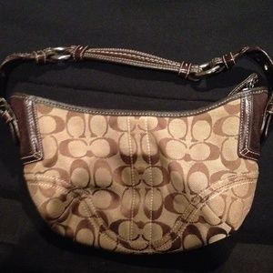 Brown medium size coach bag.