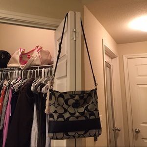 Black and gray cross body Coach purse